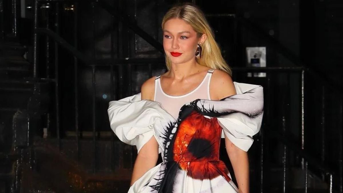 Gigi Hadid is an influential entity in the fashion world, and she demonstrated this with her most recent striking outfit. The supermodel arrived at a press event for her new Netflix series, "Next In Fashion," wearing a bone-colored minidress with an eye-catching design. Yet there was more than any eye; peering out from her waist was one with a vivid crimson iris and thick black lashes. One of the six outfits Gigi Hadid wore to promote her new project, it was evident that she gave her look a lot of consideration. She accessorized with a tank top that matched the jewelry, transparent black Calzedonia tights, and pointed dark red heels. She styled her blonde hair down and even matched the blazing red eye print with her lipstick. Gigi Hadid has a good sense of fashion, as evidenced by the fact that she owns her clothing line, Guest in Residence. She previously talked about the meaning of the eye print in an interview with Vogue, and she selected this specific dress from Sarah Burton's spring 2023 collection for Alexander McQueen. Burton claims that the eye is the most distinctive representation of mankind since each one is unique, much like a fingerprint. Also Read: Stranger Things Star Maya Hawke Makes Bold Fashion Statement At Prada Show The eye print represents a way for Gigi Hadid to rediscover things and to let people perceive one another as fellow humans. It's a strong message that feels especially relevant in today's society when people occasionally experience a sense of social isolation. Nevertheless, Hadid is inspiring us to open our eyes and genuinely see each other with her striking ensemble and wise words. Hadid's gown was only one of many gorgeous ones she wore throughout her press tour, of course. She also wore a grey sweater set from Valentino and an Alexandre Vauthier hooded jacket. Hadid flaunted her exquisite sense of style and her willingness to take chances with each outfit. Gigi Hadid is much more than simply a fashion star. She has a 2-year-old daughter named Khai, and her thoughts about respecting one another's humanity reveal that she too has a huge heart. Hadid consistently uses her position to change the world, whether she's walking the runway or fighting for social justice.