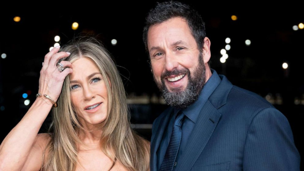 Jennifer Aniston, the Friends actress, was flabbergasted when her recent remarks on her longtime friend and co-star Adam Sandler's outfit choices led him to be titled a "style icon" by Vogue. Aniston recently made fun of Sandler's habit to show up to even the most formal events in basketball shorts and a t-shirt during an interview on "The Tonight Show Starring Jimmy Fallon." Aniston recalled a time when Adam Sandler showed up wearing satin basketball shorts, Nike high tops, and a turquoise velour shirt when they were in Italy for a "fine dinner." She was taken aback by his clothes, but it looks that Sandler's sense of style has resonated with some people having a similar choice. During her interview, Jennifer Aniston commented, "Vogue, you know, kind of made him a style icon." Thanks to Vogue, he is now saying, "Vogue says I'm wonderful like this!" Now Adam Sandler is feeling like awarded the style icon title, so he is thanking Vogue for it. Also Read: Tracylor Aka Isora: The Parisian Rapper Who Thrives On Playful Rhythms After meeting at Jerry's Deli on Ventura Boulevard when they were both about 20 and 22 years old, Jennifer Aniston and Adam Sandler have been close friends for more than 30 years. Aniston credits their bond to taking care of one another and watching out for one another. On the set of their movie, "Murder Mystery 2," she frequently served as the "mobile pharmacy" and set medic. Jennifer Aniston made fun of Sandler's wardrobe choices, but she recently gave him the Mark Twain Award for American Comedy at the Kennedy Center, where she was accompanied by Drew Barrymore, Chris Rock, and Pete Davidson. It seems like their friendship will continue to thrive, no matter what fashion choices Sandler makes.