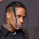 The American rapper and artist Travis Scott gets trapped into trouble after being accused of assault and criminal mischief at a nightclub in Midtown, New York City. The "Sicko Mode" singer may have punched a sound engineer in the face and broken his phone early on Wednesday morning at the Nebula nightclub, according to individuals close to law enforcement who spoke to Paparazzi. Despite Scott's manager, Ted Anastasiou, alleging that the charges were part of a "possible cash grab," officials are allegedly ready to interrogate the rapper about the allegations. Scott allegedly appeared irritated when the music volume was turned down and attempted to play DJ himself, according to the nightclub's sound engineer. Scott allegedly joined rapper Don Toliver on stage following Toliver's earlier that evening at Irving Plaza performance. Although the motive of the alleged assault has not been confirmed, an eyewitness said that Scott made a fuss before pushing someone into the DJ booth and yelling, "Back the fuck off." The rapper is also accused of damaging nightclub equipment to the tune of about $12,000 in total. Also Read: A Music Escapade From Love Island To WWE: Topps Chanzo Mitchell Schuster, Scott's lawyer, believes that his client will be exonerated of all charges despite the accusations. According to Schuster, the event was "obviously a mistake," and his team is prepared to work with local police to put things right. Richie Romero, the managing partner of Nebula, also commented on the occurrence and said that the news had "blown entirely out of proportion." Romero referred to the evening as "wonderful" and asserted that the media had exaggerated the charges. Grammy-nominated musician Travis Scott is well-known for his upbeat performances and musical collaborations. The rapper has already come under fire for his live performances, with some fans alleging that he incites reckless behavior there. Scott faced criticism in 2021 for his participation at a festival in Houston, Texas, when eight people died and several more were hurt. The latest in a long line of scandals involving the rapper are the claims of assault and criminal mischief at the Nebula nightclub. His lawyers and spokesperson, though, have denied any wrongdoing.