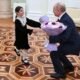 In Kremlin stunt, Putin and girl, 8, lobby minister for budget funds