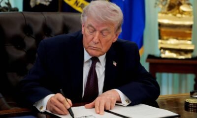 FILE PHOTO: U.S. President Trump signs an executive order in the Oval Office of the White House