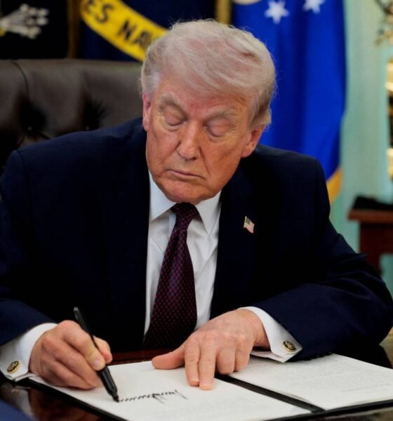 FILE PHOTO: U.S. President Trump signs an executive order in the Oval Office of the White House